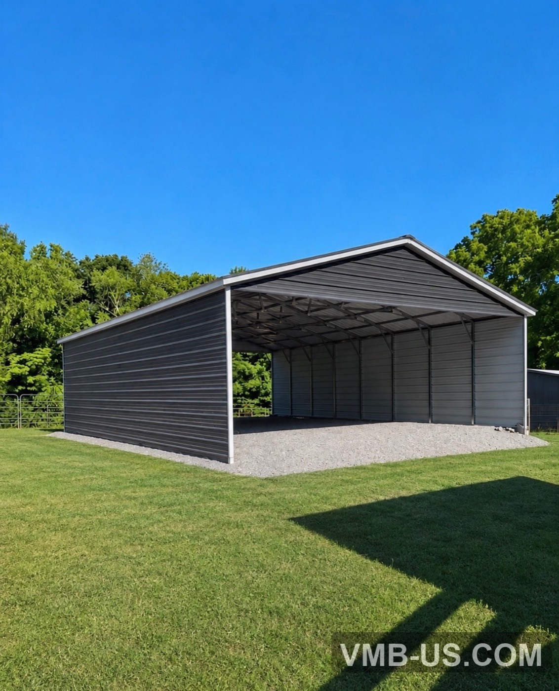 Large dark metal agricultural equipment shelter