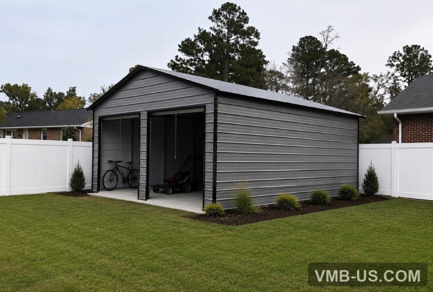 Gray custom metal building in a residential backyard